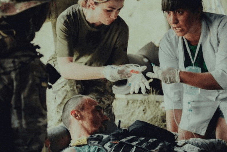 Medics continue to work in a field hospital at the frontline.